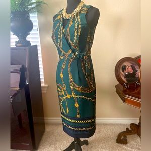 EnFocus. Size 6. Green dress with gold chain pattern. Short sleeve. Below knee.